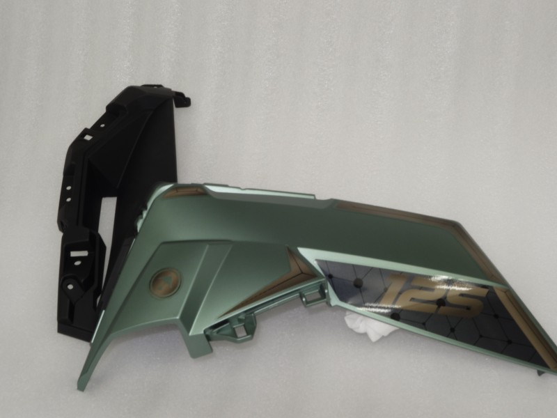 Side cover front left turn signal green Xplore 125